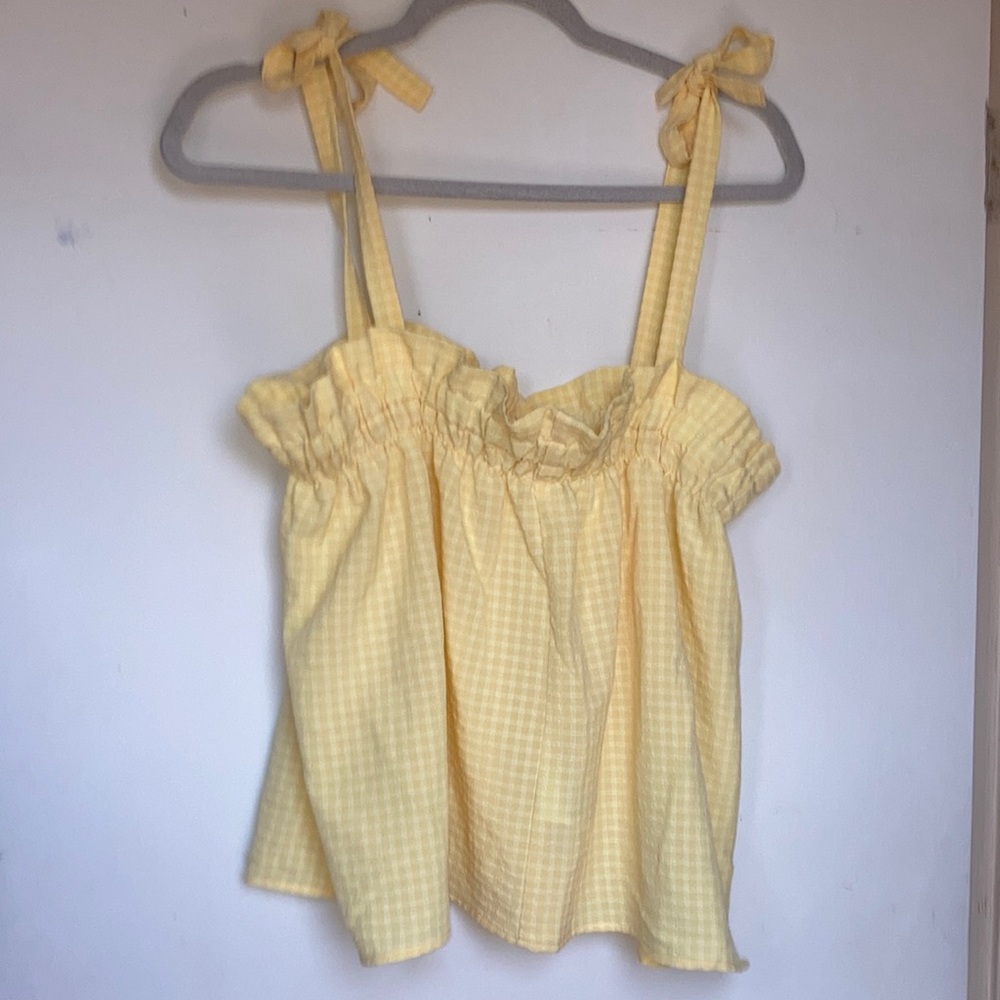 Yellow flowy blouse with ties on the shoulder